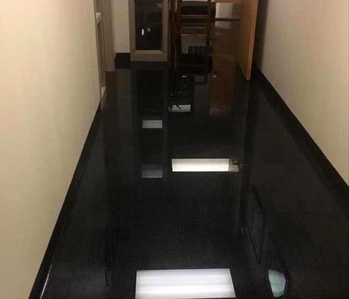 sitting water in hallway soaking the carpet