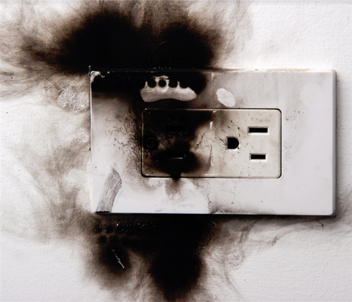 a fire damaged wall outlet