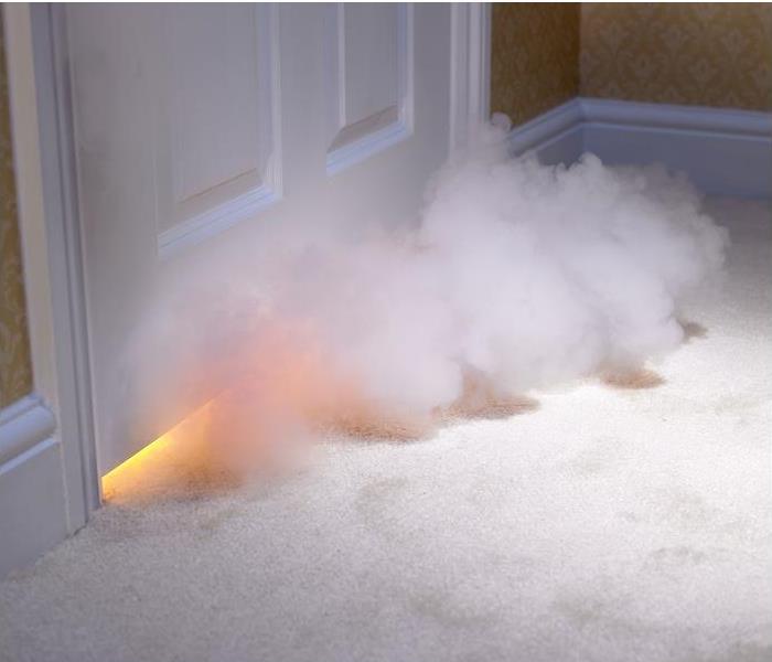 smoke entering room through under door