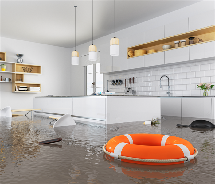 flooded modern white kitchen with a circular orange lifebuoy
