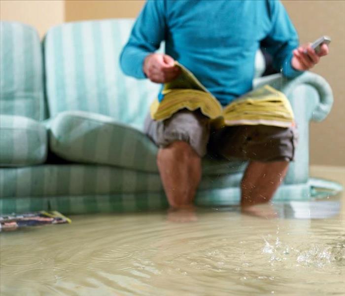 Man on Couch in Flood