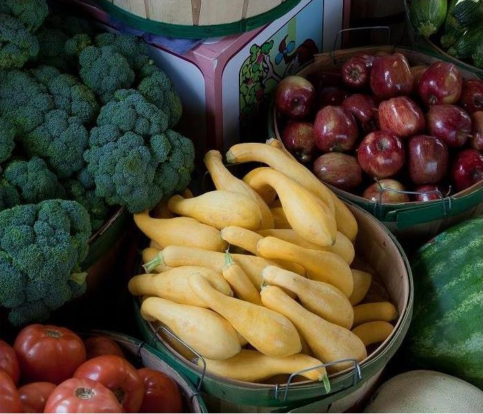 baskets of fruit and vegetables at farmer's market